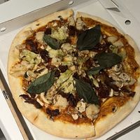 «Sjampis» Mushroom pizza with added sundried tomatoes, basil and artichoke.  at Kafe Spesial in Bergen