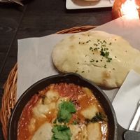 Vegan spinach shakshuka with lentil soup and hummus sandwich in the background at Kafe Spesial in Bergen