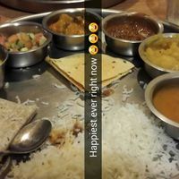 Soup, potatoes, lentils, mixed veggies, veggie salad (tomatoes, onions, cucumber) and an apple chutney at Vatica Indian Restaurant in Marietta