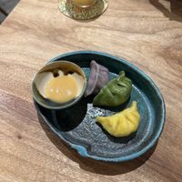 Rainbow gyoza (purple yam, spinach, pumpkin) with yuzu miso saucee  at KOKU Vegan Ramen Kyoto in Kyoto