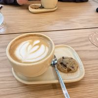 Flat white with oat milk with a complimentary vegan cookie  at Koala in Buenos Aires