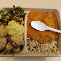 The Large Hot Meal option: hot main and brown rice on the right and two cold salads on the left. A spoon of hummus as a bonus! at Revive Cafe - Wyndham St in Auckland
