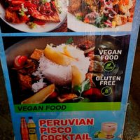 Sign outside at Chifa La Familia Feliz in La Fortuna