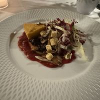 Baked polenta with leaf salad, chutney, mushrooms  at Restaurant Stella Freiburg in Freiburg