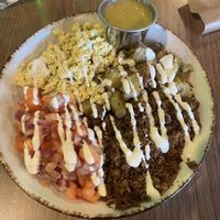 Breakfast burrito bowl! Spicy sauce  at Avo in Nashville