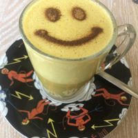 Happy smile Vegan golden latte  at Bagels & Beans - Haarlemmerdijk in Amsterdam