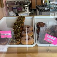 Display case with clearly labeled vegan options  at Sweet Donuts in Olympia