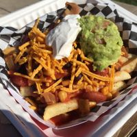 Vegan Chili Cheese Fries! Topped with Daiya cheddar, Tofutti sour cream, and guac. Amazing... at Emergency Munchie Truck in West Lafayette