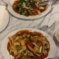 Basil stir fry with tofu (top) and sweet and sour stir fry with tofu (bottom). Both made without fish and oyster sauce.  at Siam Square in Hawaii