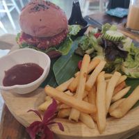Vegan beet burger with fries and salad at Indigo Cafe in Luang Prabang