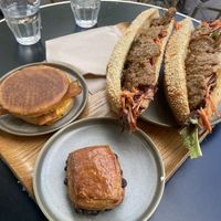 Bacon and cheddar muffin, Swiss bread, and Farmer sandwich (all vegan)  at Land & Monkeys - Beaubourg in Paris