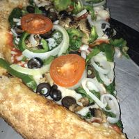 Vegan cheese on the delicious VegOut pizza at Mellow Mushroom in Decatur