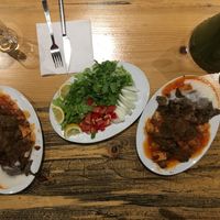 Vegan iskender and a green part of lahmacun. at Vegan Community Kitchen in Istanbul