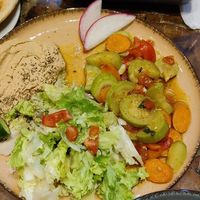 Veggie plate with zucchini, carrots, salad and hummus at Vegan Community Kitchen in Istanbul