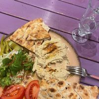 Hummus served with bread and salad   at Vegan Community Kitchen in Istanbul
