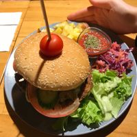 Very big Vegan Burger with potatoes and salad  at Vegan Community Kitchen in Istanbul