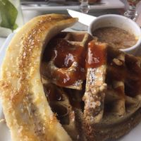Sunday Brunch option: waffles with Caramelized bananas, bourbon-peach sauce, and smoked almond butter at Small Batch in St Louis