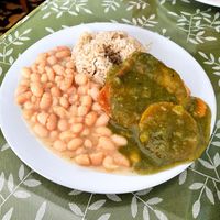 Main dish - tofu steak with a side of stewed beans and brown rice  at Sayel in Lima