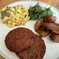 just egg scramble, sausage, potatoes, kale salad at Quail + Crane in San Francisco