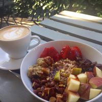 Vegan porridge with seasonal fruits and nuts at Secret Life Cafe in Warsaw