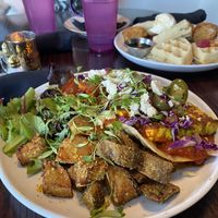 Tofu Benedict (chicken and waffles in the background)  at Modern Love in Omaha