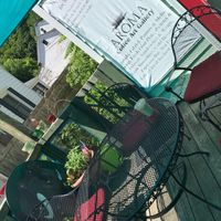 outdoor patio in summer  at Aroma Coffee Art Gallery in Hammondsport