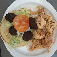 Falafel Sandwich on pita w/ lettuce, onions, tomato, & tahini sauce w/ vegetable of the day: cauliflower at The Parthenon Greek Grill in Lincoln