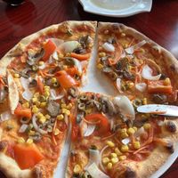 Veggie pizza without cheese. The crust is amazing and the toppings good.  at Golden Flower in Tornio