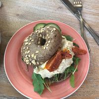 Oathie bagel with hummus, sun-dried tomatoes and rockets!  at Bagels & Beans - Ruyschstraat in Amsterdam