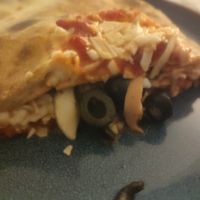 Vegan calzone filling (black olives, ham, mushroom) at Pizza Vera in Rugby