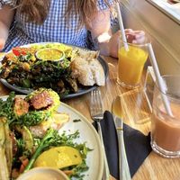 Vegan benedict with duke smoothie and vegan breakfast with orange juice  at Kin Cafe Vegetarian in London