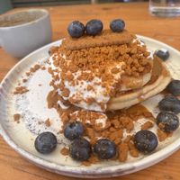Biscoff pancakes with coconut yoghurt, blueberries & maple syrup   at Kin Cafe Vegetarian in London