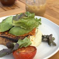 January 2026: avocado, semi dried tomato 'nduja' toast, slow roast tomato, whipped sunflower seed vegan ricotta, farm leaves  at Kitchen Farm Pantry in Mount Barker