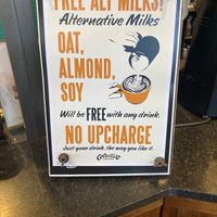 Placard in store: no vegan surcharge for plant milk! at Colectivo Coffee Evanston in Evanston