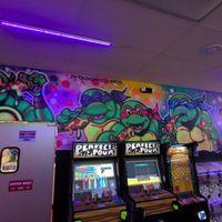 Interior bar wall art at LeaderBoard Arcade Bar & Pizzeria Jax in Jacksonville