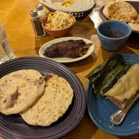 Empanada is the middle plate. Pupusas on the left and tamale on the right. So good 🤤 at Los Chorros Restaurant in Silver Spring