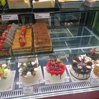 Cake display from outside at Bravo Patisserie in Brighton
