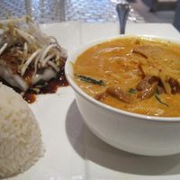 Red Curry Duck (super good) with rice and square noodle roll with black sweet chili (didn't like the sauce) at Pukk in New York City