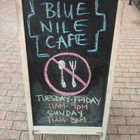 Outside sign from a few years ago...double check the hours! at Blue Nile Cafe in Kansas City