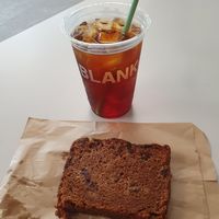 Peach iced tea and banana bread at Blank Street Coffee in Manchester