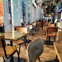 Indoor seating at Farm Girl Paddington - Market Halls in London