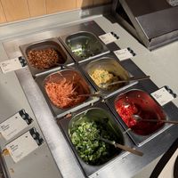 Self service topping station  at Marugame (The Strand) - Japanese Udon Noodles & Tempura in London
