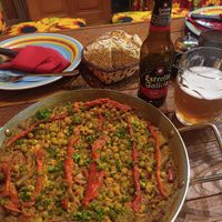 Paella de la huerta and house bread at ¡Madrid Olé! in Grecia