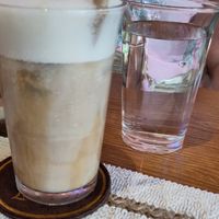 Oat latte, complementary water at La Solana Coffee - Brunch - Eatery - Work space in Hoi An