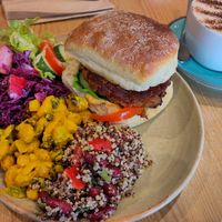The Waterside Burger with selection of 3 salads. at Waterside Cafe in Kendal