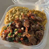 Vegan Citrus Short Ribs meal with Jollof Rice and Vegan Mac  at Anegada Delights Caribbean Cuisine in Columbia