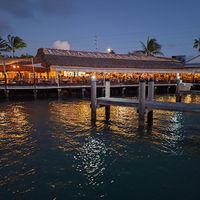 View of the restaurant at dusk. at The Island Fish Co. Restaurant & Tiki Bar in 