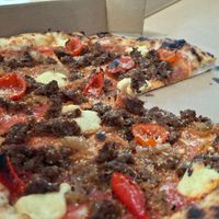 
VEGAN CALABRESE - 
red sauce, cashew mozzarella, house-seasoned Impossible sausage, peppadew peppers, caramelized onions, vegan parmesan
 at Wild Flour Pizza Co in Abbotsford