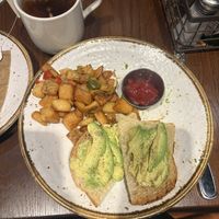Avocado toast and breakfast potatoes  at PDX - Henry's Tavern in Portland
