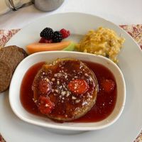 Completely vegan French toast with vegan sausage, potatoes and fruit. at Heartstone Inn Bed & Breakfast and Cottages in Eureka Springs